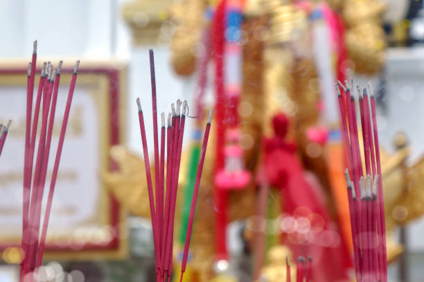 istock Burning aromatic incense sticks for buddhist praying 1930655526