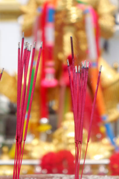 istock Burning aromatic incense sticks for buddhist praying 1930656318