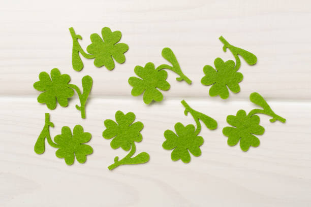 istock Felt clover on wooden background, top view. St. Patricks day concept 1930691680