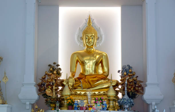 istock Close up golden colored Buddha sculpture 1930695409
