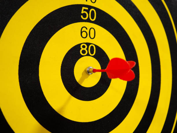 istock Dartboard with dart arrow in bullseye, close up 1930716811