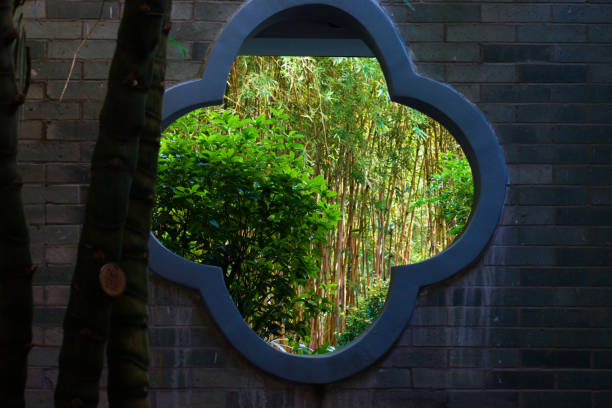 Dongguang, Guangdong, China, Oct 28, 2023: A brick wall with a flower petal shape window.