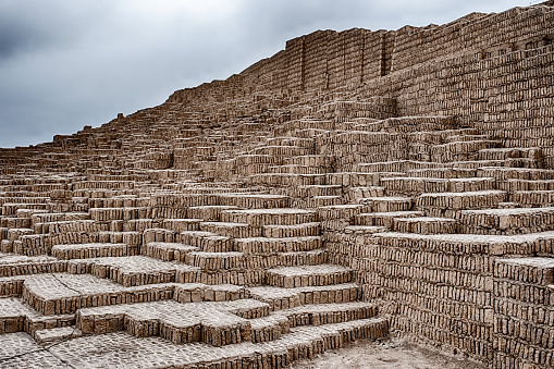 The Huaca Pucllana pyramid is constructed with tiers of adobe bricks as it rises to the sky in Lima.