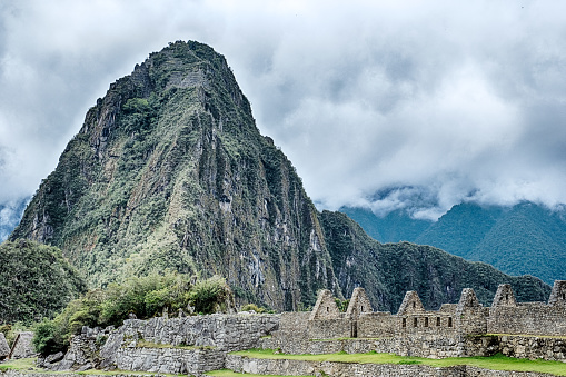 The small mountain of Huayna Picchu looms over the presumed royal palace of Machu Picchu in the foreground.