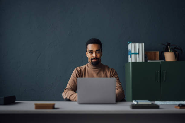 istock Portrait of an Office Worker Engaged with Laptop Tasks 1930804526