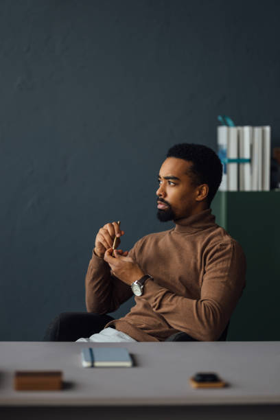 istock Businessman in Quiet Contemplation at Work 1930804529