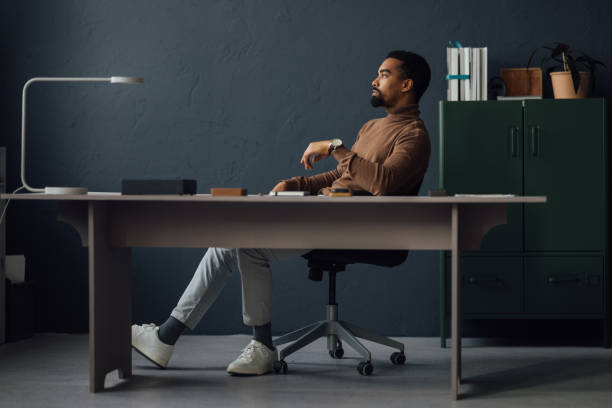istock Businessman in Quiet Contemplation at Work 1930804531