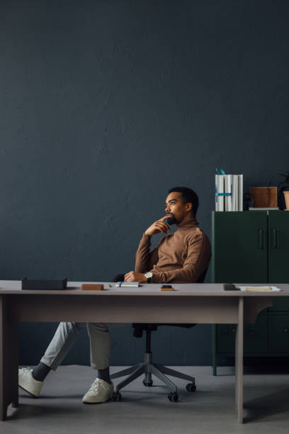 istock Businessman in Quiet Contemplation at Work 1930804532