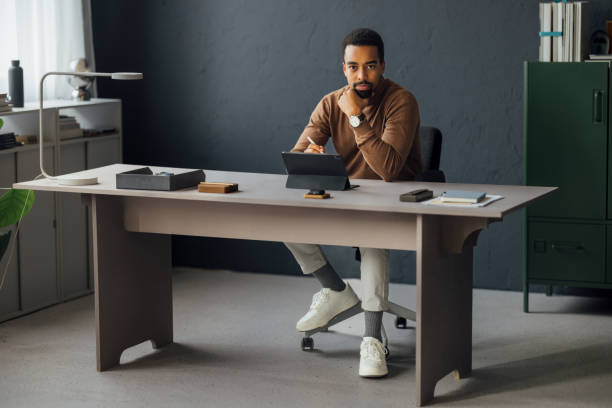 istock Young African American Businessman Using Tablet in Office 1930805054