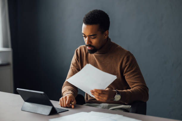istock Entrepreneur Examining Financial Reports 1930805063