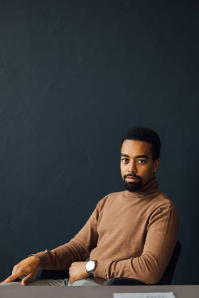 istock Office Worker Seated at Desk in Thought 1930805072