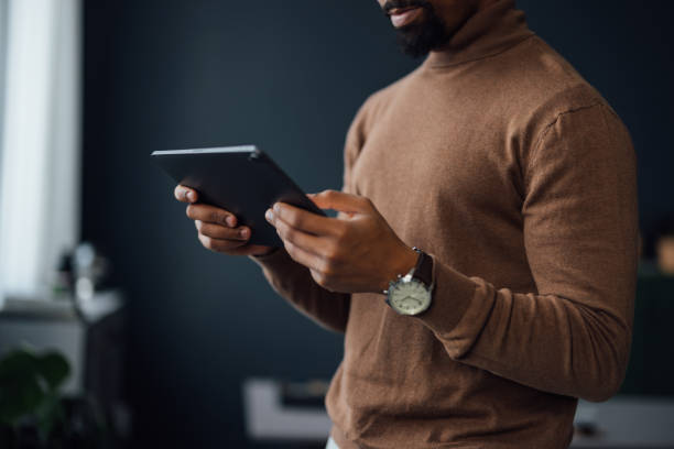 istock Hands of a Businessman Using Tablet in Office 1930805564