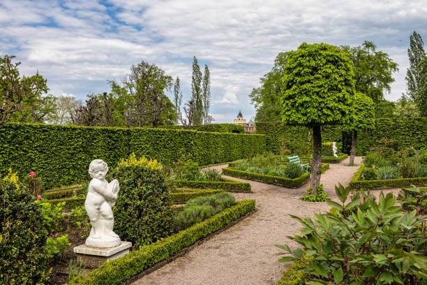 Weimar, Germany - May 12, 2023: Russian garden in Castle Belvedere near Weimar Thuringia Germany. It is a elegant summer residence dating from 18th century. View from the Castle park.