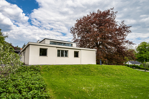 Weimar, Germany - May 12, 2023: Haus am Horn building in Weimar, Germany with grass lawn. Haus am Horn is the only truly Bauhaus building in Weimar.