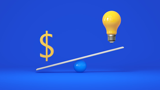 Rise in Price of the Cost of Electricity in the Form of a Dollar Sign and a Light Bulb on Scale Seesaw. Balance Scale on Blue Studio Background. Business Concept. 3D Render.