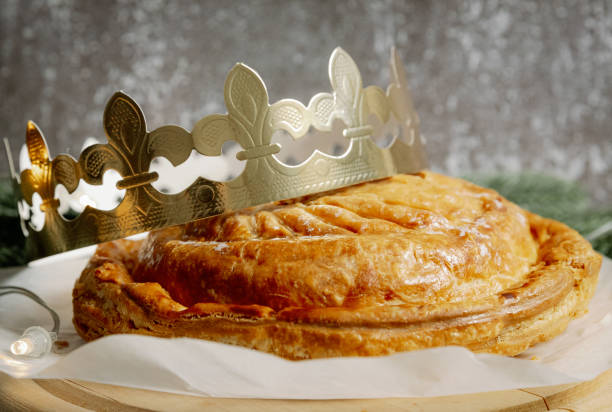 istock One whole fresh royal galette with a crown on a gray background. 1930909602
