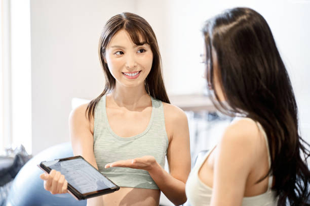 istock Trainer giving counseling at the gym 1930934976