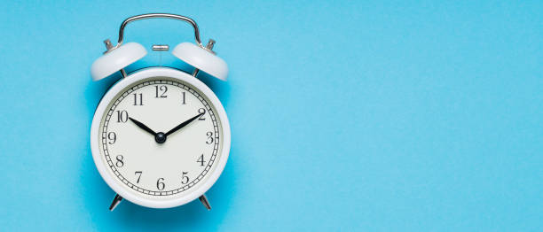 istock Classic Analog Alarm Clock on Blue Background, Time and Change Concept, Copy Space 1930961406