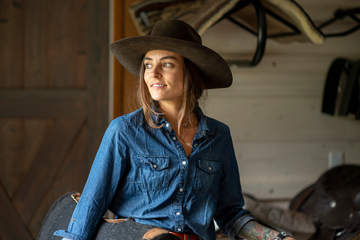 Portrait of rancher woman in stable