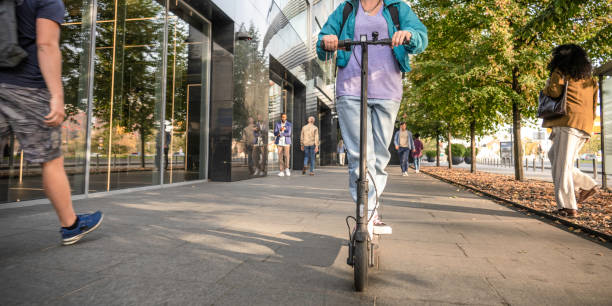 istock Woman riding electric scooter, low section 1930967222