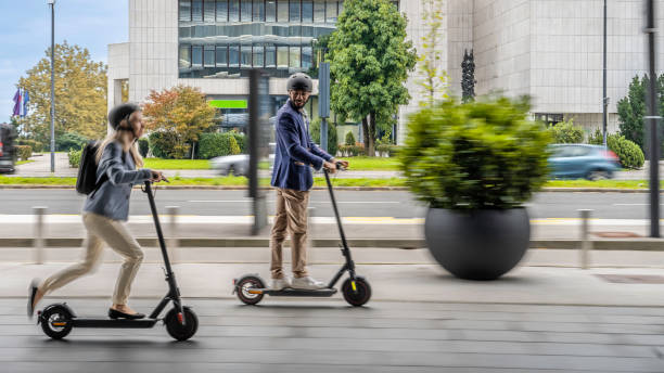 istock Smiling couple riding electric scooter 1930967371