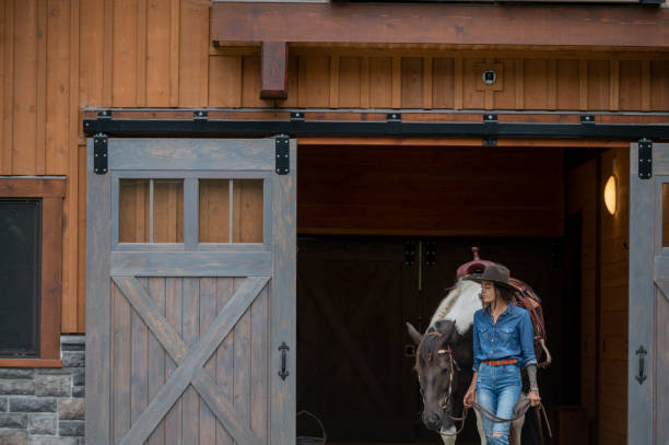 istock Young woman at ranch 1930967918