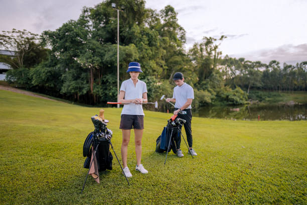 Asian Chinese golfers getting ready to play golf in golf course weekend early morning