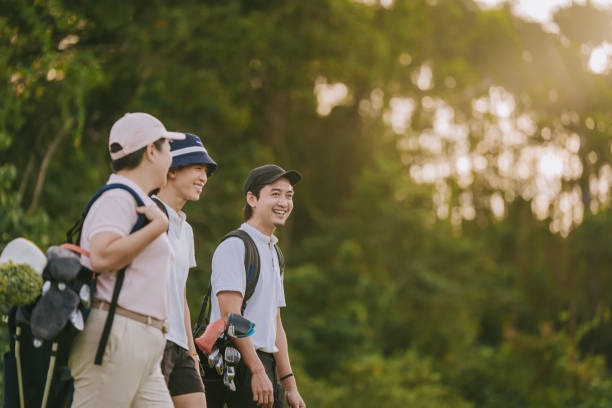 istock 3 asian chinese golfers walking in golf course playing golf weekend morning 1930981927