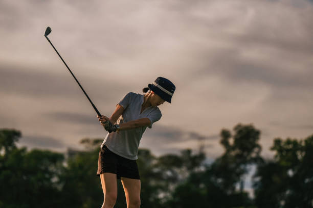 istock Asian Chinese female golfer playing golf in golf course weekend morning 1930984611