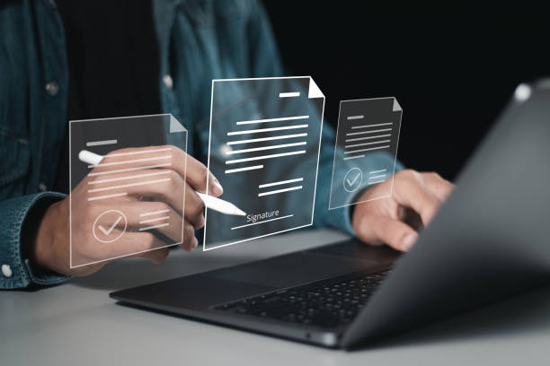 istock Businessman use laptop and signing electronic documents in digital documents for electronic signature concept. , Signing contract to approve a business project, paperless document office. 1930987994