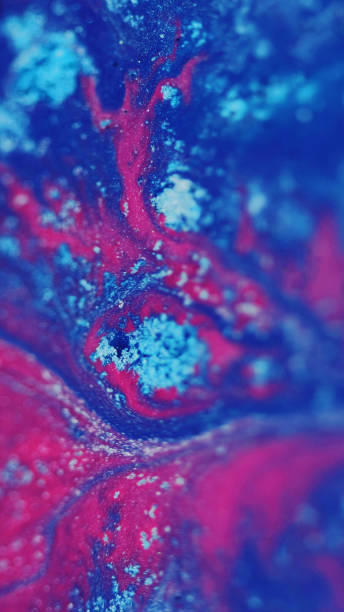 istock fluid paint background wet ink texture blue pink 1931035223