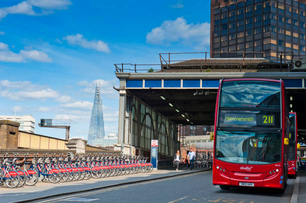 Waterloo bus station, London's cycle hire scheme - Santander Cycles and The Shard in London, England London, England - May 30, 2015: Waterloo bus station with a Bus Route 211, London's cycle hire scheme - Santander Cycles (formerly Barclays) called Boris Bikes and The Shard in London boris bus stock pictures, royalty-free photos & images