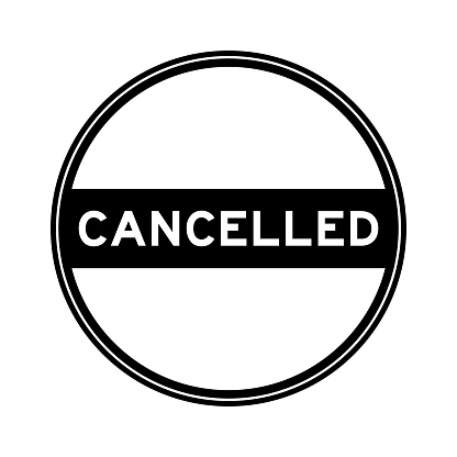 Black color round seal sticker in word cancelled on white background