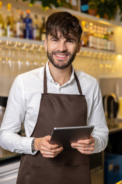 istock Smiling young pizzeria worker feeling good in a working place 1931089168