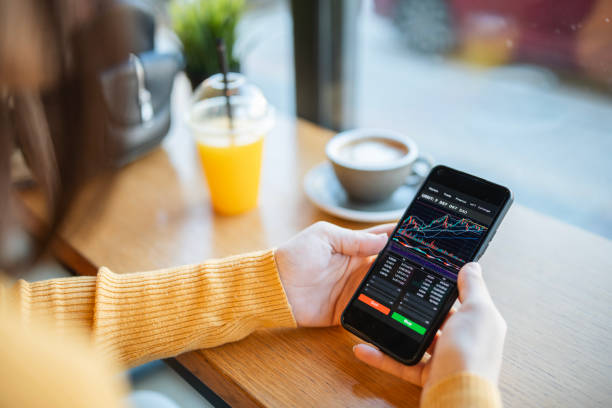istock Trading with cryptocurrency on smartphone and enjoying coffee. 1931095282
