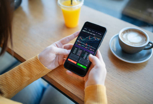 istock Crypto trading during a coffee break in cafe. 1931095283