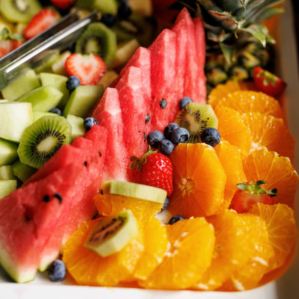 istock A vibrant fruit platter with watermelon, kiwi, strawberries, blueberries, and oranges on a white dish 1931095888