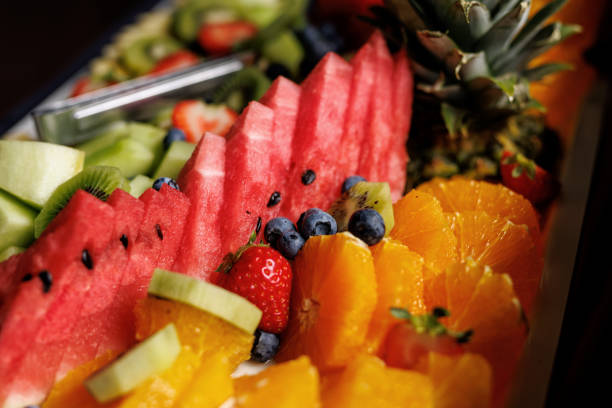 istock A vibrant fruit platter with watermelon, kiwi, strawberries, blueberries, and oranges on a white dish 1931095889