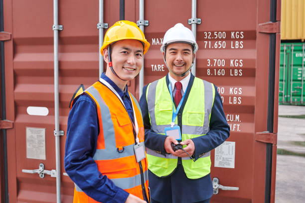 istock Two Asian Males Dock Worker Portrait 1931168322