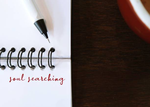 istock Notebook on copy space wood with text written SOUL SEARCHING, means taking step back to examine life and reconnect to inner self, dig deeper to find purpose when feel lost, stuck or uninspired 1931177026