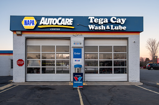 Fort Mill, South Carolina, United States - 13 January 2024:  NAPA Auto care center wash and lube at the Tega Cay Village Shopping Mall in Fort Mill, South Carolina.