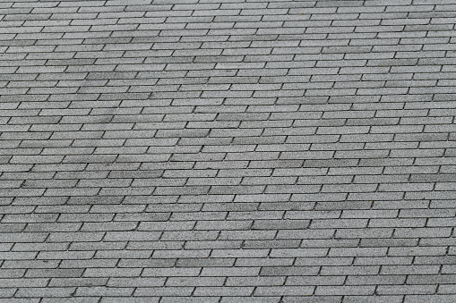 close up on gray roof shingle background