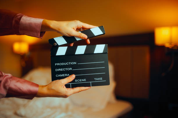 istock Hand Holding a Film Slate in a Bedroom 1931393281