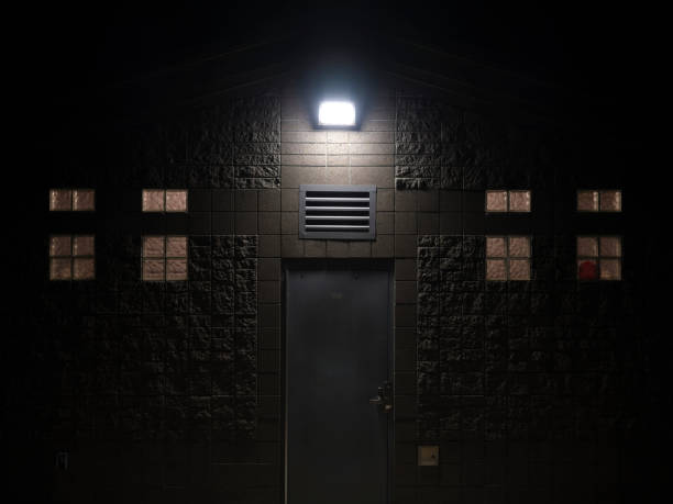 Floodlight illuminating outside of a structure at night