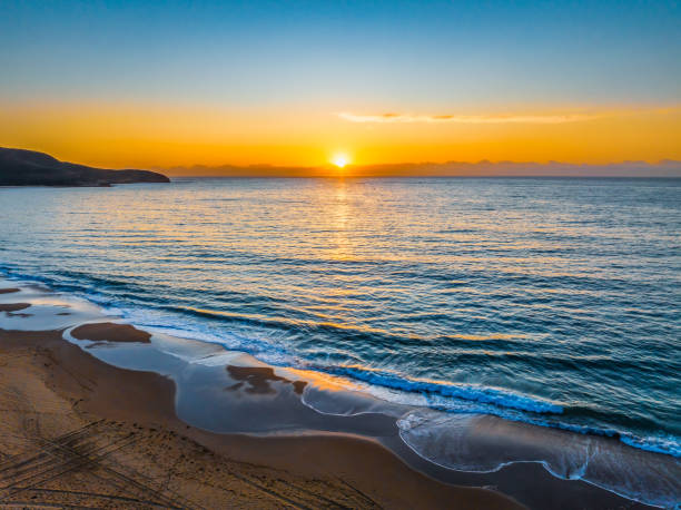 istock Sunrise at the seaside with orange horizon 1931451226