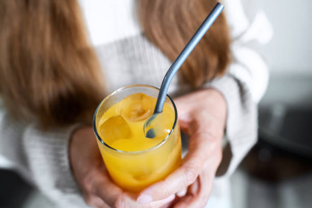 istock Woman with metal straw in her drink 1931548143