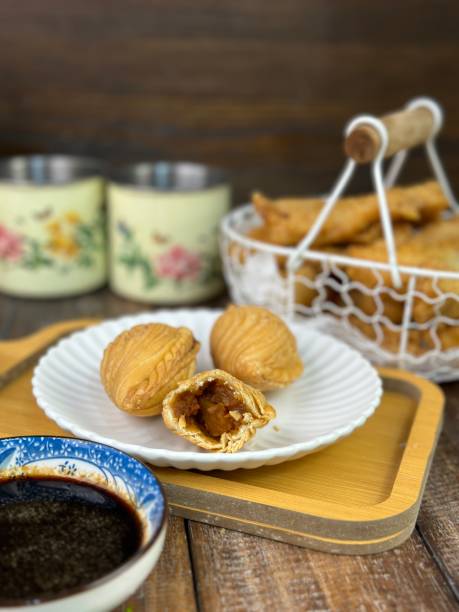 istock Curry Puffs Epok-Epok or Karipap Pusing - Deep Fried Malaysian, Singaporean, and Thai snack filled with curried meat and or vegetables. 1931552345