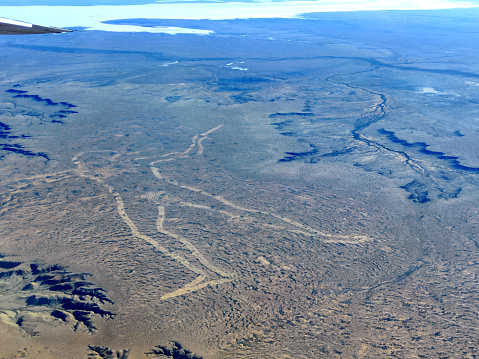 Aerial view of the Marree Man, a modern geoglyph discovered in 1998. It appears to depict an Indigenous Australian man hunting with a boomerang or stick. It lies on a plateau near Kati Thanda-Lake Eyre at Finnis Springs 60 km west of Marree in South Australia. The figure is 2.7 km tall with a perimeter of 28 km. Although it is one of the largest geoglyphs in the world, its origin remains a mystery, with no one claiming responsibility for its creation.