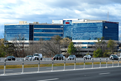 Fairfax, Virginia, USA - January 10, 2024: The National Rifle Association of America (NRA) Headquarters building seen across Interstate 66 in Northern Virginia on a cloudy day.