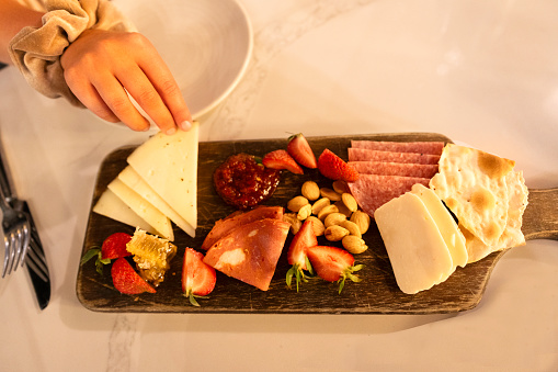 Top view of charcuterie board with cheese and meat, San Antonio, Texas, USA